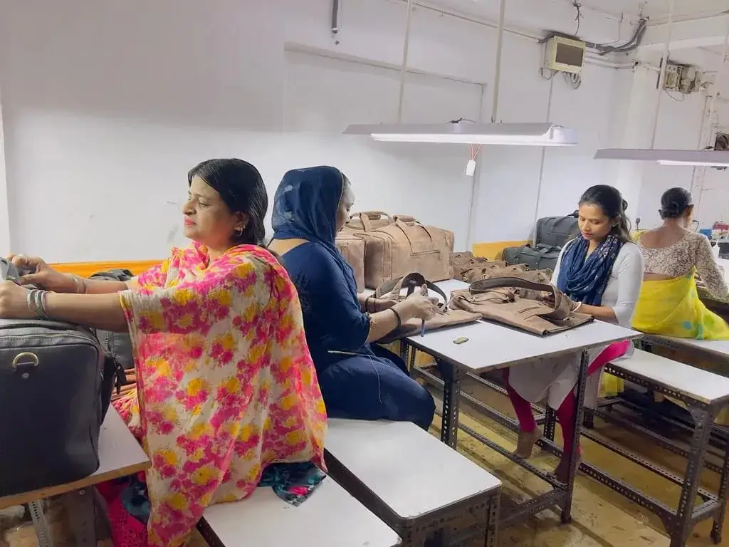 Women artisans finishing bags